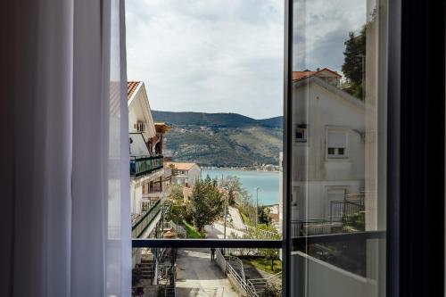 a view of a city from a window at Apartments Ivo Herceg Novi in Herceg-Novi