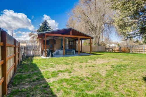 a small house with a fence and a yard at Rexburg Escape with Fenced Yard and Covered Patio! in Rexburg
