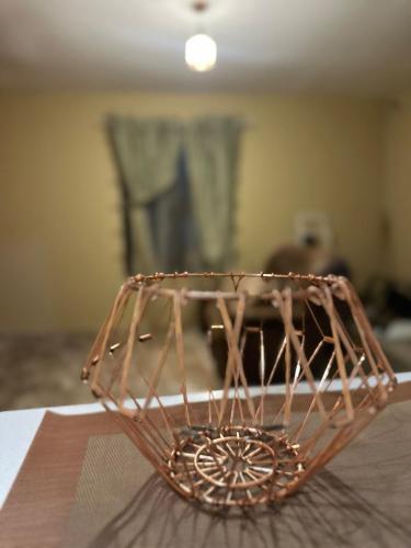 a wooden bowl sitting on top of a table at Maun self-catering unit in Maun