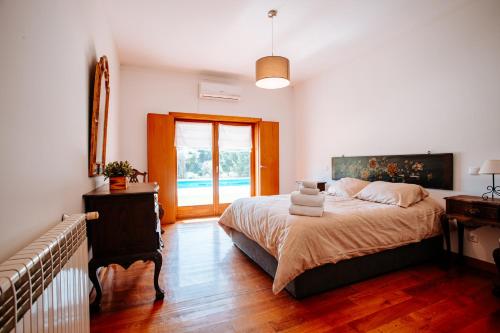 Postel nebo postele na pokoji v ubytování Casa da Calçada