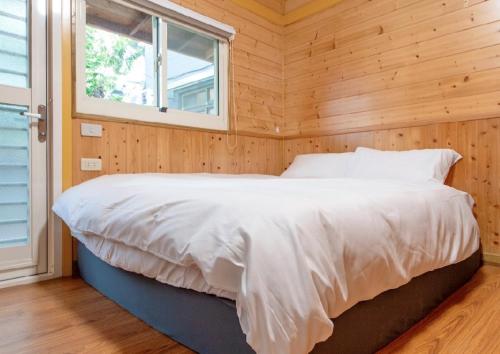 Postel nebo postele na pokoji v ubytování Shanding Shang Homestay