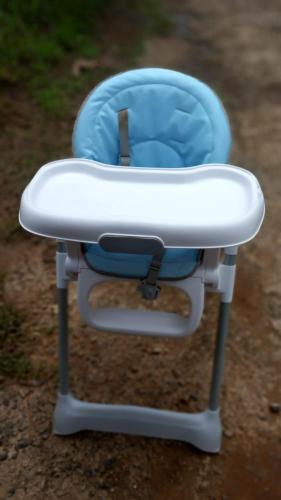 a blue and white chair sitting on the ground at Appartement Madinina 6 personnes vue sur mer dans village vacances in Sainte-Luce
