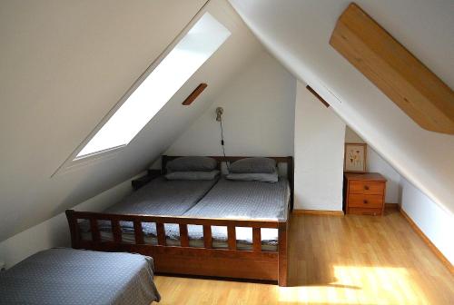 a bedroom with a bed in the attic at Supeluse 23 Holiday Home in Pärnu