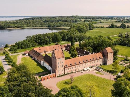 an aerial view of a large castle with a lake at Cozy Summer cottage in Tosteberga, close to the Sea in Fjälkinge