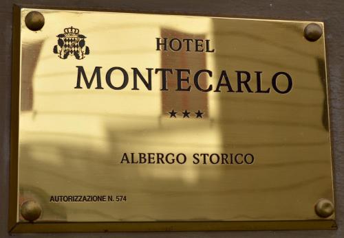 a sign for a hotel montecarco at Hotel Montecarlo in Rome