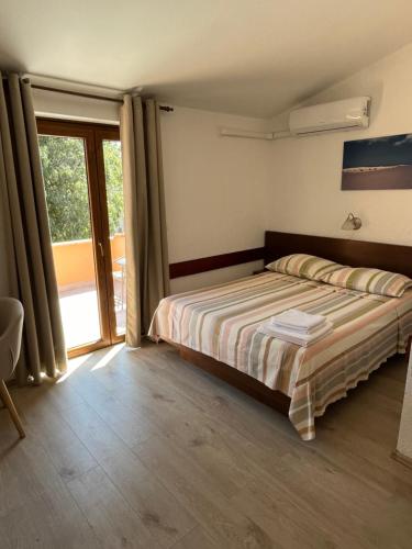 Postel nebo postele na pokoji v ubytování Rooms Danica