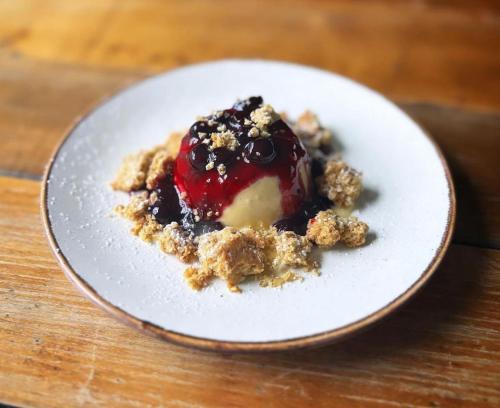 a white plate with a piece of dessert on it at Royal Oak Hotel in Rosthwaite