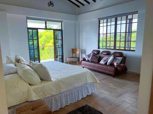 Postel nebo postele na pokoji v ubytování Balcón de Antioquia Rancho La Soledad