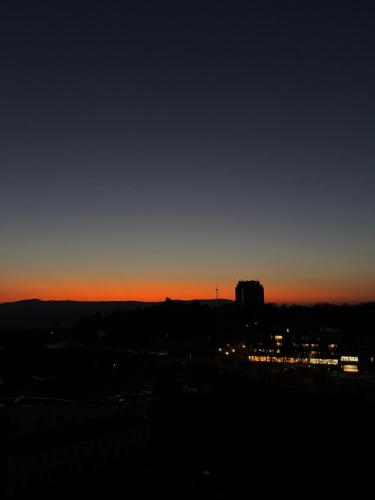 a sunset over a city with the sky at Peak11 Fewo- Panorama View Lahnstein Pool & Sauna in Lahnstein