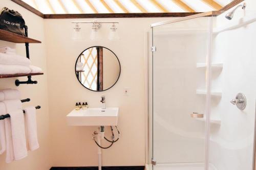 a bathroom with a sink and a shower at Johnny Yurts - The Pearl in Johnson City