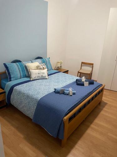 a bedroom with a large bed with two towels on it at La CIASSA 00942-LT-0372 in Noli