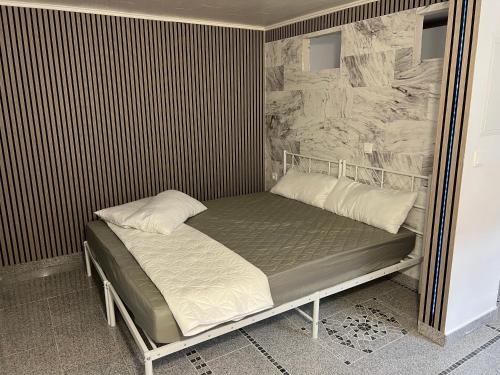 a bed with two pillows on it in a room at Zum Sterngässchen in Ludwigshafen am Rhein