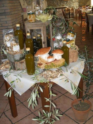a table with a bunch of bottles on it at Agriturismo Oddone in Bardineto