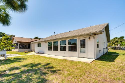 a large white house with a yard at Direct Gulf Access Hernando Beach Escape! in Hernando Beach