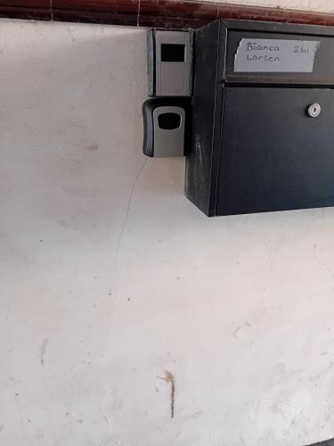 a close up of a box with a wire coming out of it at centrally located apartment in Bogense