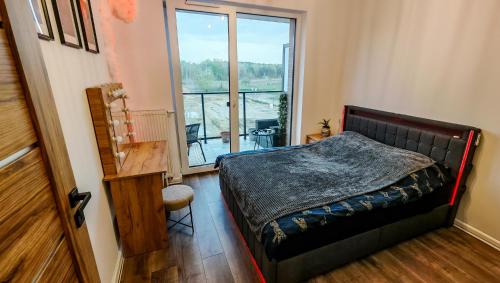 Ένα ή περισσότερα κρεβάτια σε δωμάτιο στο Apartament Na Chopina