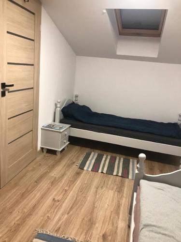 Postel nebo postele na pokoji v ubytování Stefanowy Domek