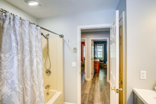 a bathroom with a shower curtain and a tub at Walk to Ski Slopes Jiminy Peak Resort Getaway! in Hancock