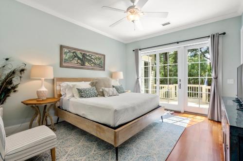 a bedroom with a bed and a window at 253 Governors Drive by Akers Ellis Rentals in Kiawah Island