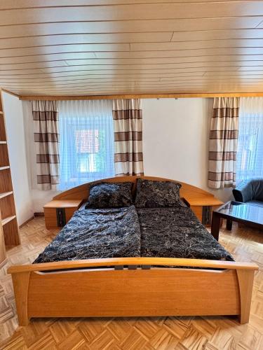 a bedroom with a large bed in a room at Ferienwohnung-Mixnitz-Bärenschützklamm 3 in Mixnitz