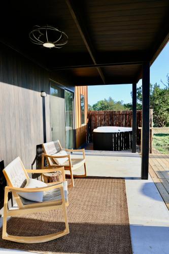 a patio with two chairs and a table at The Martinsburg in Stonewall