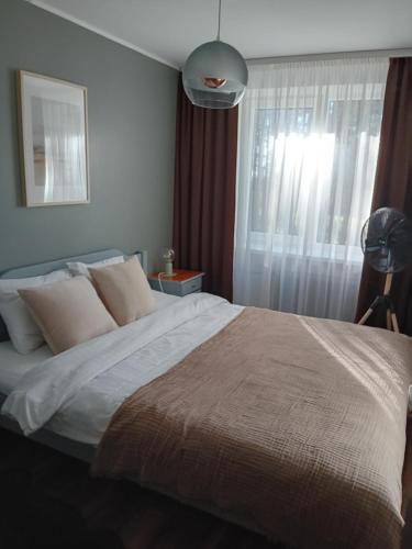 Кровать или кровати в номере Zvejnieku apartamenti