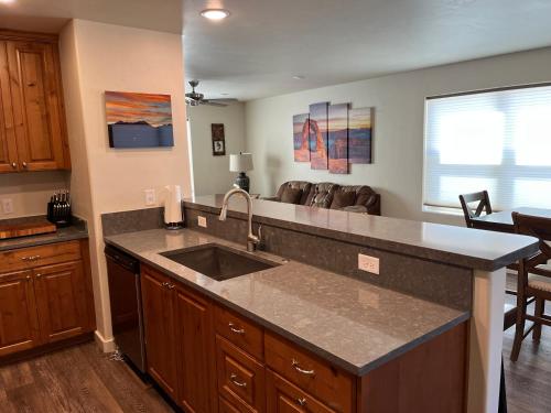 a kitchen with a sink and a counter top at Moab Views, Pool, Hot Tub, Natl Parks in Moab