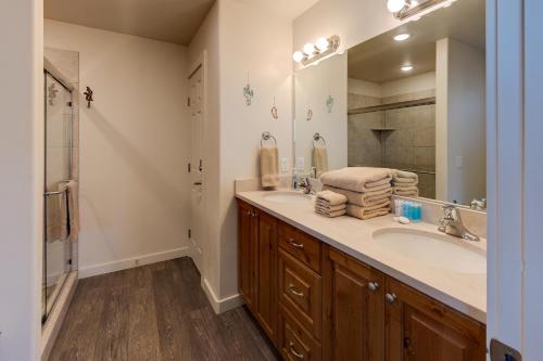a bathroom with a sink and a mirror at Moab Views, Pool, Hot Tub, Natl Parks in Moab