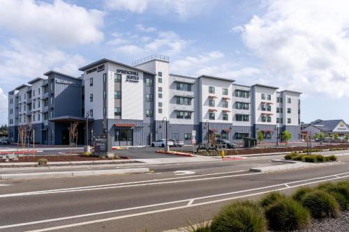 a large white building on the side of a road at Residence Inn by Marriott San Luis Obispo in San Luis Obispo