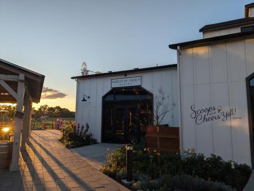 a white building with a door with a sign on it at Residence Inn by Marriott San Luis Obispo in San Luis Obispo