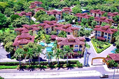 an aerial view of a resort with palm trees at Luxury 2BR Escape near Tamarindo in Tamarindo