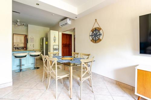 a kitchen and dining room with a table and chairs at Luxury 2BR Escape near Tamarindo in Tamarindo