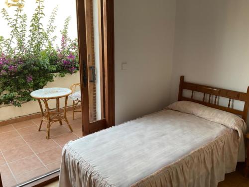 Postel nebo postele na pokoji v ubytování Adosado rustico familiar amplio