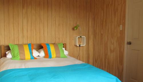 A bed or beds in a room at Cabañas Entre Parques