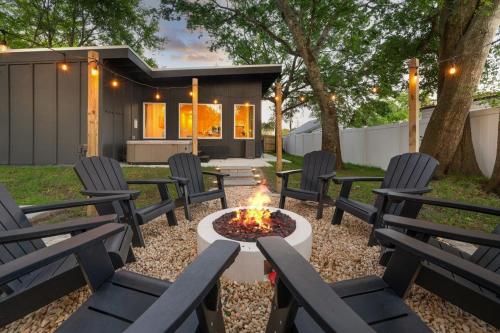 a group of chairs around a fire pit in a yard at New-Dog Friendly,Hot Tub, Fire-pit, 1 mile to DTWN in St. Augustine