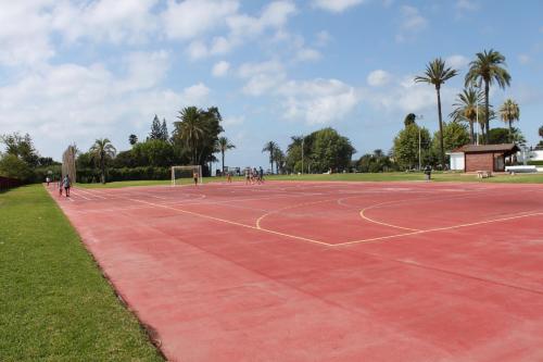 a tennis court in a park with people on it at Sol Marbella Estepona Atalaya Park in Estepona