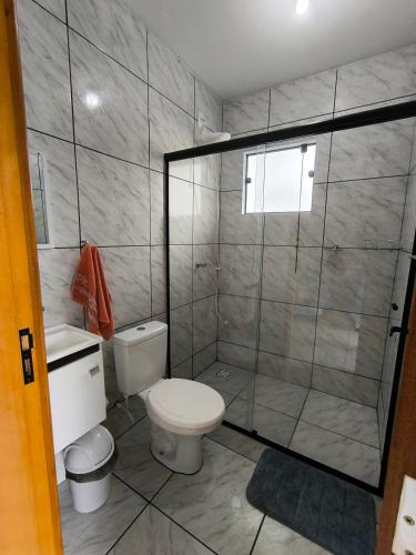 a bathroom with a toilet and a shower at Kiebitz Haus in Pomerode