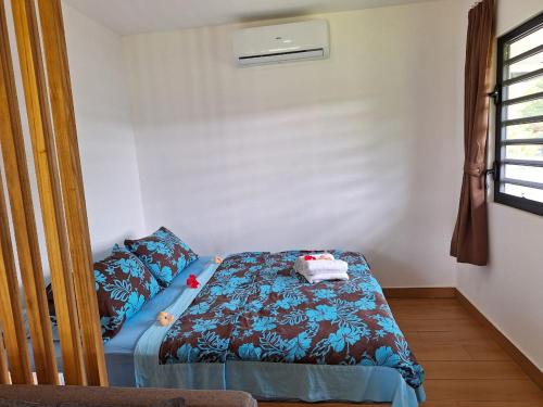 Ένα ή περισσότερα κρεβάτια σε δωμάτιο στο Papeari sea side 2 Logement neuf en bord de mer