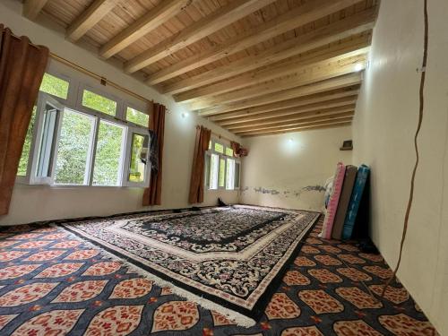 Ένα ή περισσότερα κρεβάτια σε δωμάτιο στο Moon Light Guest House Khaplu