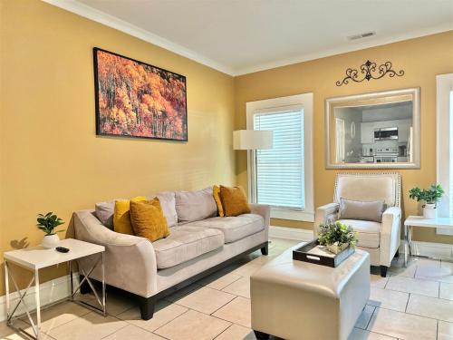 a living room with a couch and a table at Home in Downtown Concord in Concord