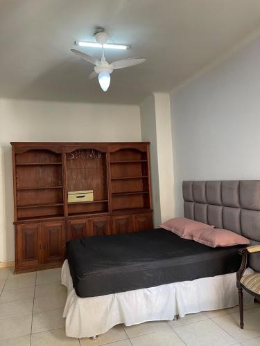 a bedroom with a bed and a ceiling fan at CasteloSaoMiguel in Rio de Janeiro
