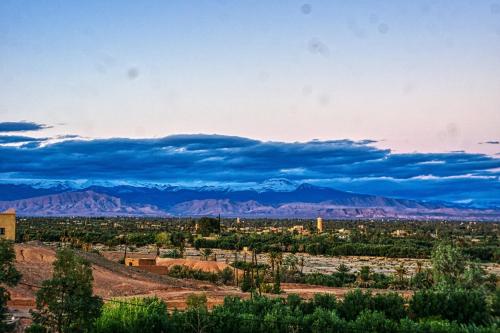 a view of the desert with mountains in the background at Lamtounipalace in Ouarzazate