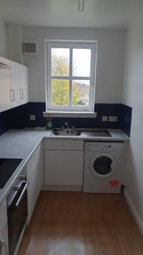 Kuchyň nebo kuchyňský kout v ubytování Room Away