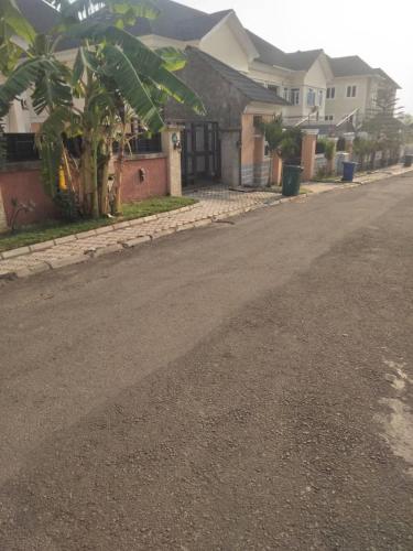 an empty street with houses on the side of the road at TUT's Place in Sabo Kukwaba