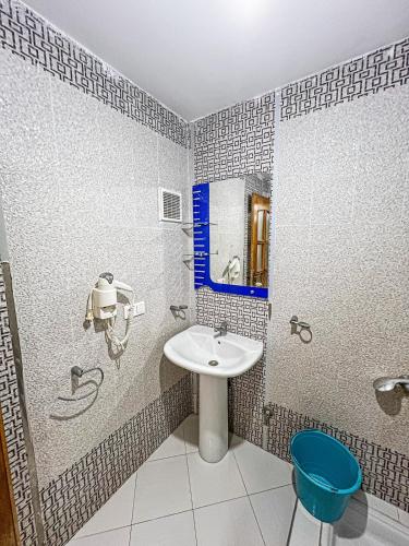 a bathroom with a sink and a mirror at Visit Chamal - Oualya in Oued Laou