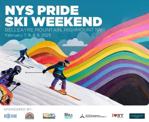 three people skiing down a snow covered slope with a rainbow at Windham Ridge Chalet in Windham