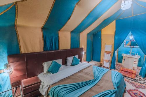 Ένα ή περισσότερα κρεβάτια σε δωμάτιο στο Desert Experience Glamping