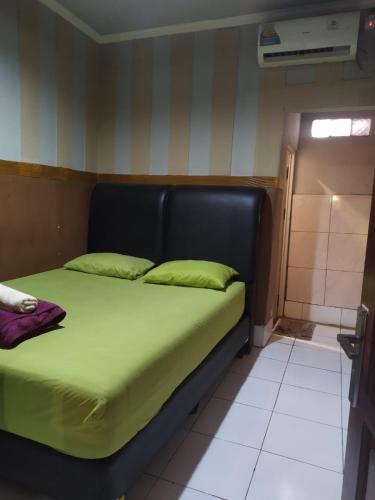 Postel nebo postele na pokoji v ubytování Pemda 22 Mansion