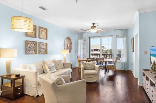 a living room with a couch and chairs and a table at The Village Blue Haven Condo - Private Beach Access Pool & Hot Tub in Rosemary Beach