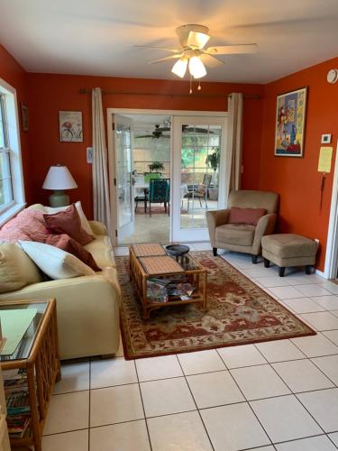 a living room with a couch and a table at One Bed Suite near Beaches and Downtown Sarasota in Sarasota